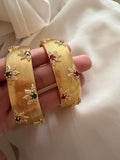 Flower encrusted open bangle cuff