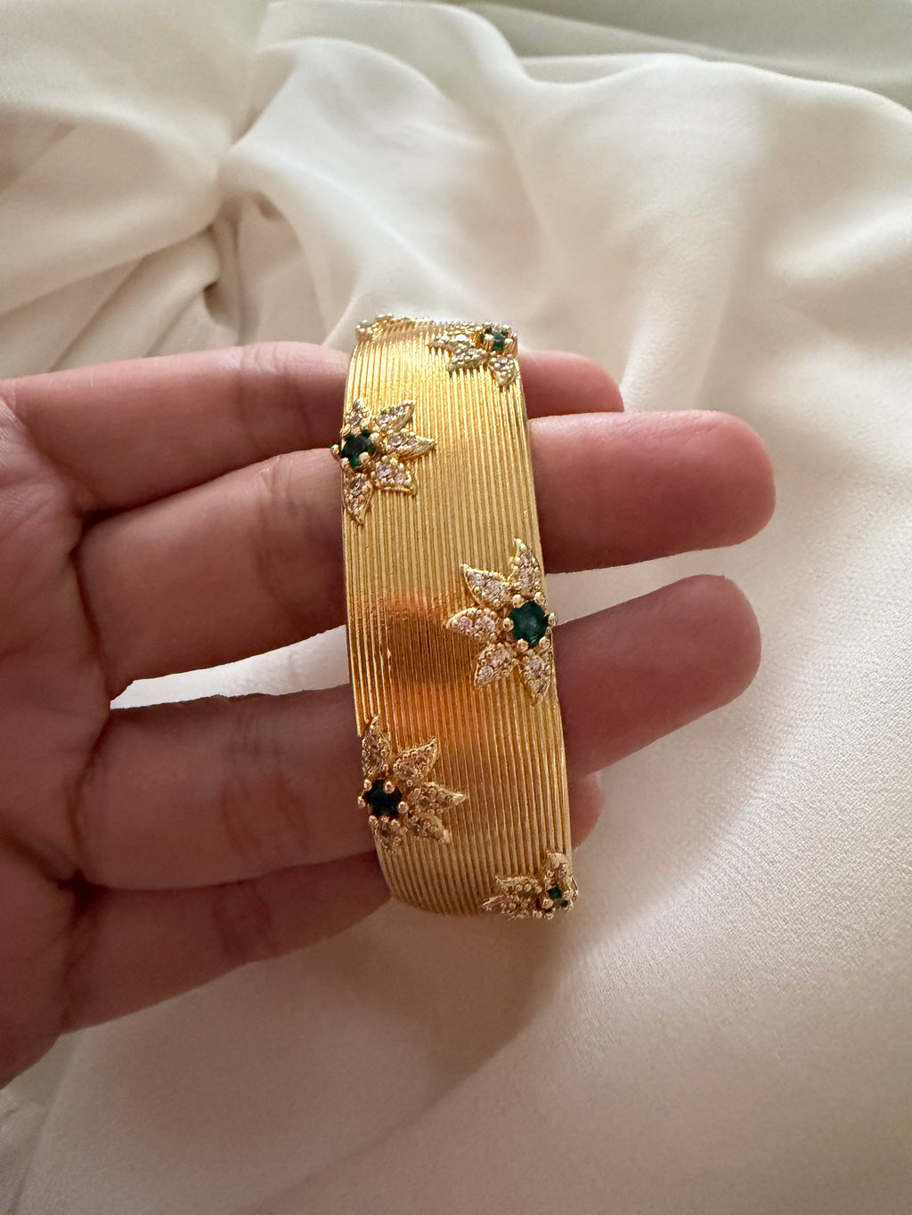 Flower encrusted open bangle cuff